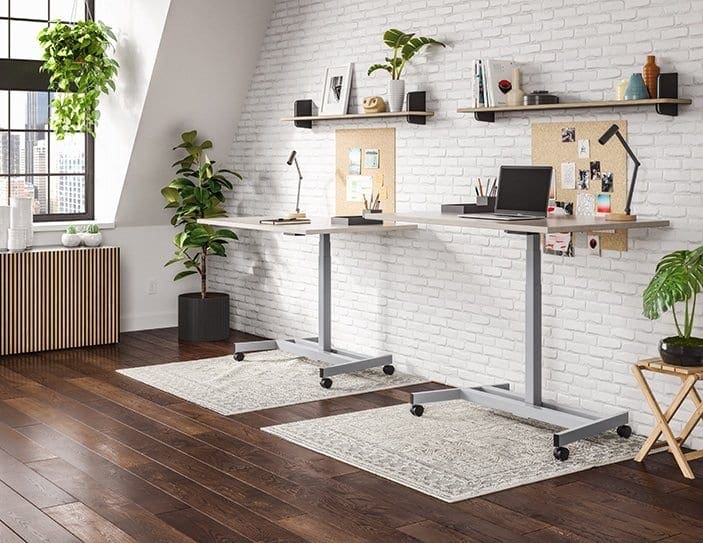Two height-adjustable desks in a shared office rendering
