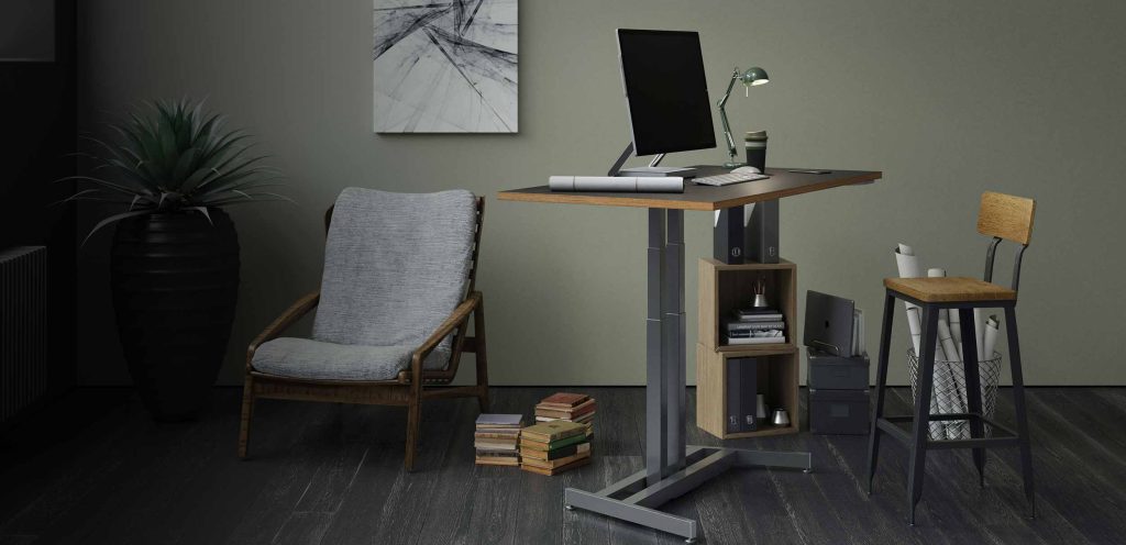 Height-adjustable desk with monitor in an office setting