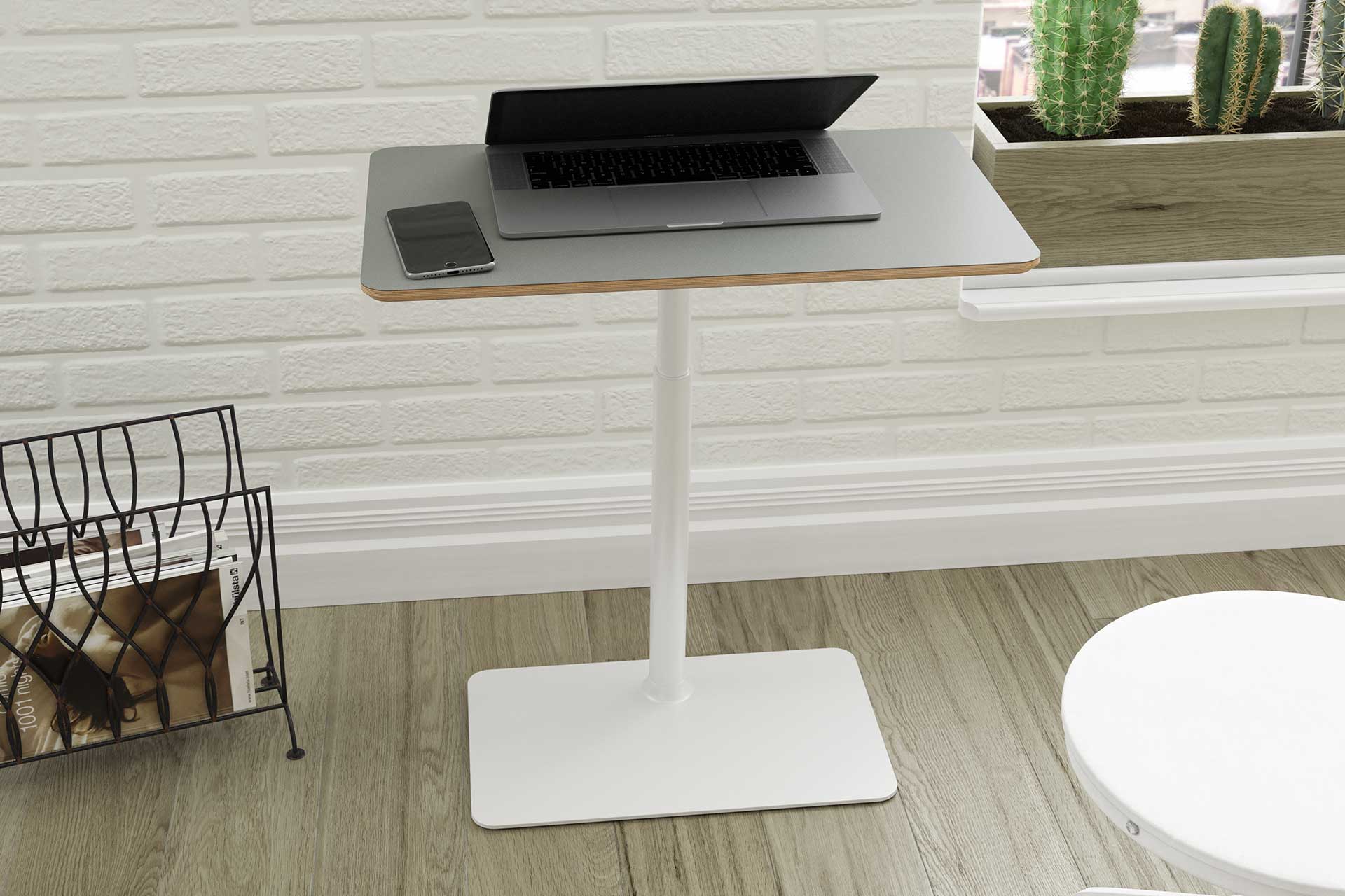 White Möbel work surface holding a laptop and phone