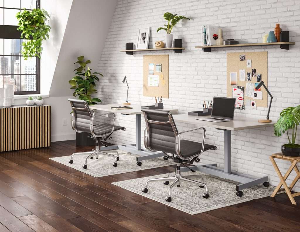 Two chairs at height-adjustable workstations in an office